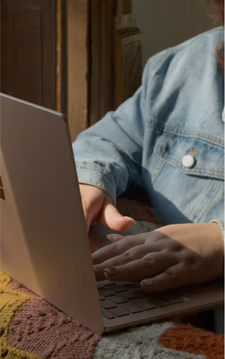 A person typing on a laptop
